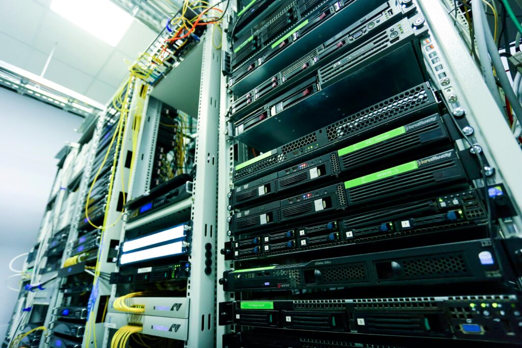 pexels photo 6466141 6466141 High-tech server rack in a secure data center with network cables and hardware components.